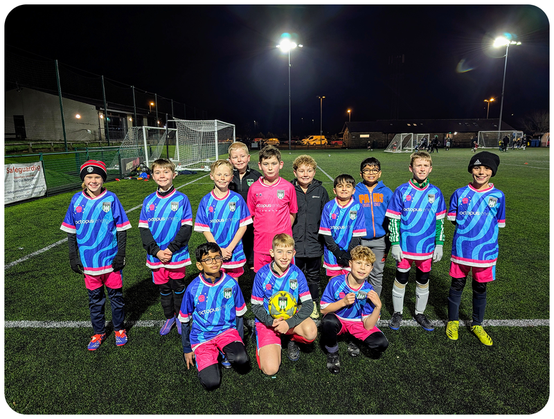 A group of young football players in Octopus Energy football kits