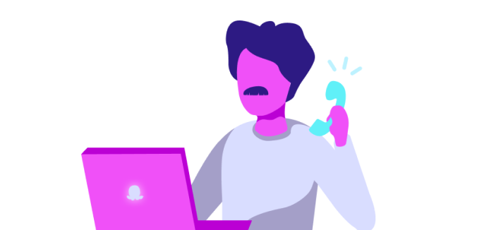 An Octopus worker on the phone with a laptop in front of him