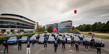 OEV team throwing plushies in the air in a car park