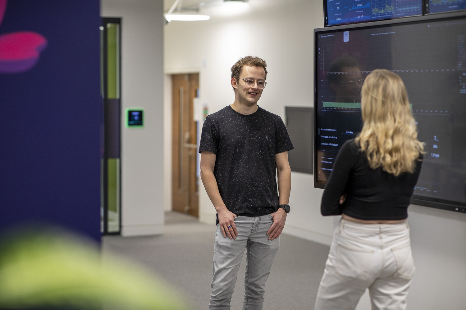 aaron in the office with a colleague
