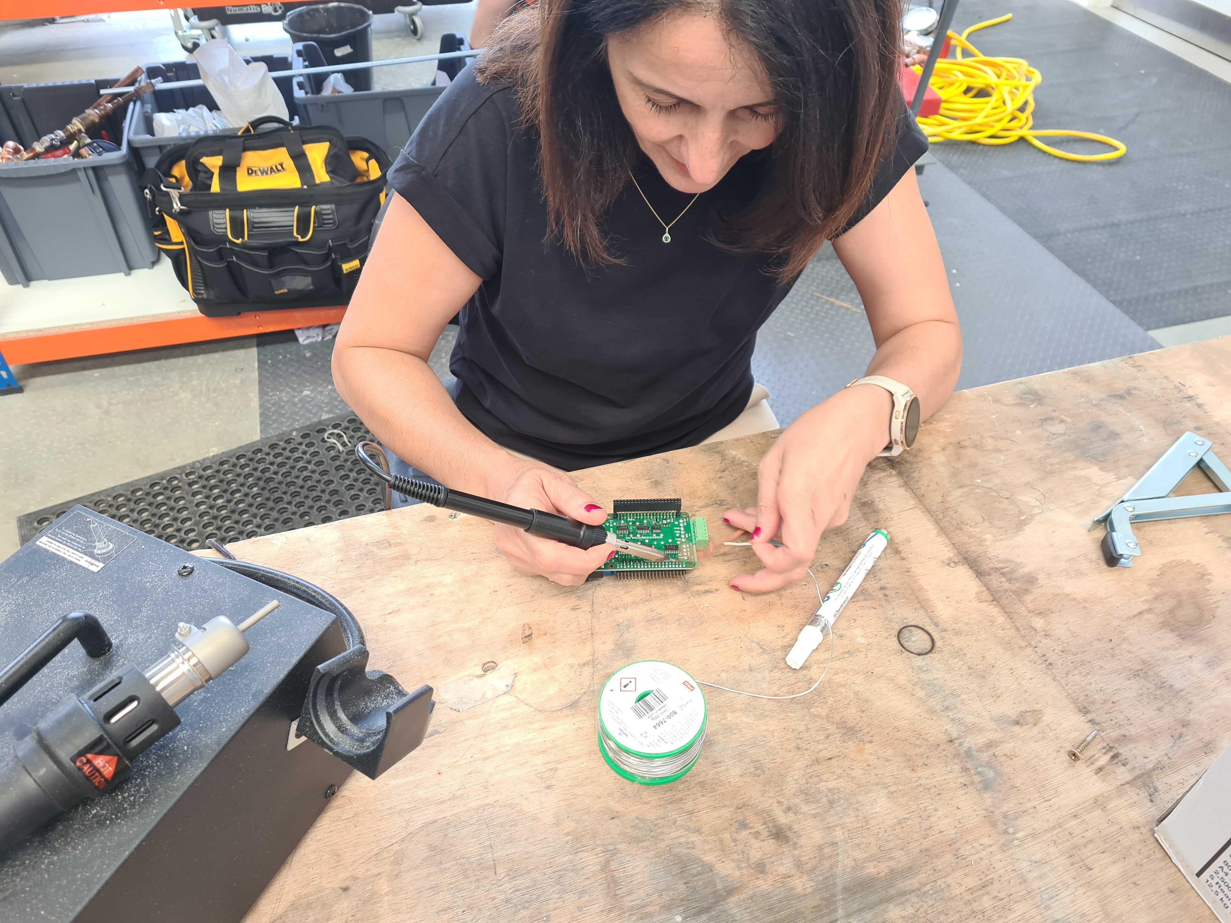 An action shot of Derya working on her design hardware