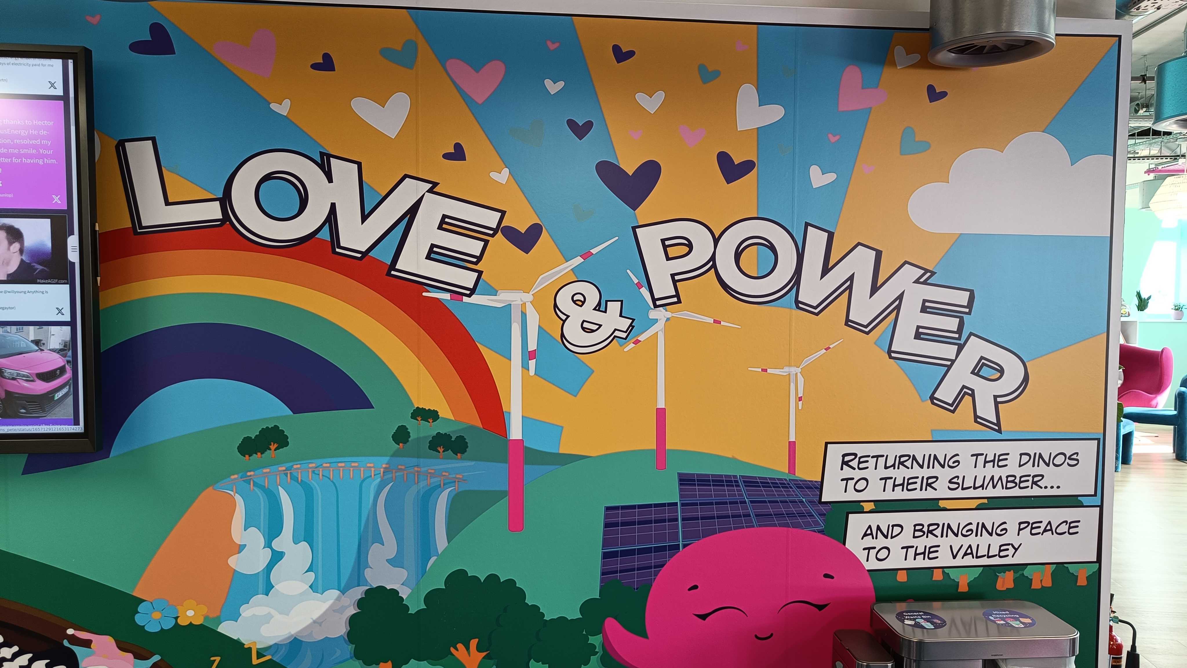 a photo saying 'love and power' on the office mural