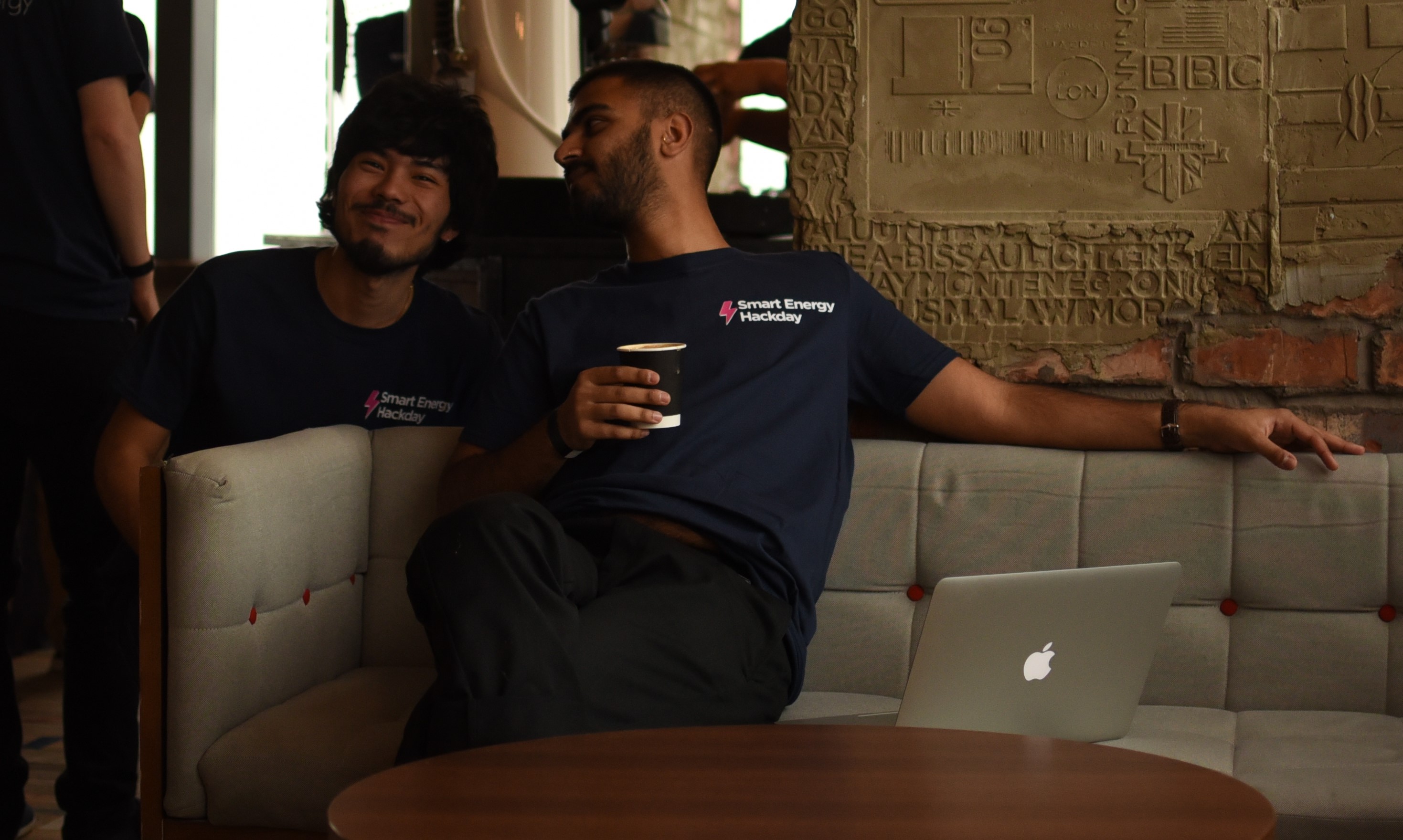 Photo of Suraj and Karim chatting at the office
