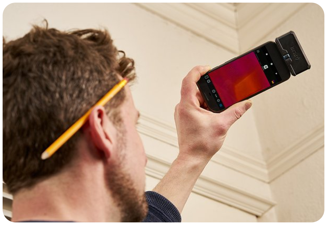 A man using a thermal camera