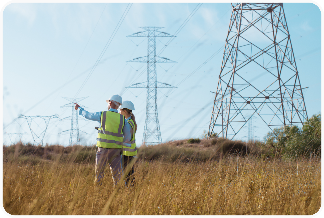 Engineers in a field with bylons