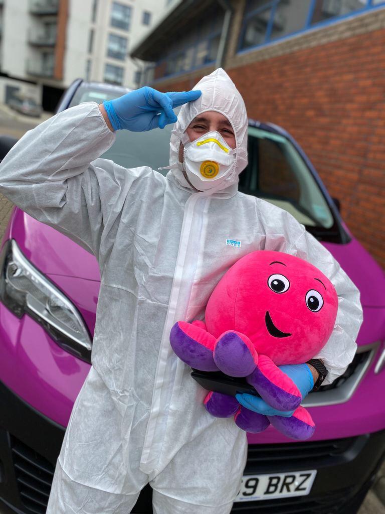 A metering engineer in protective coveralls with an octopus