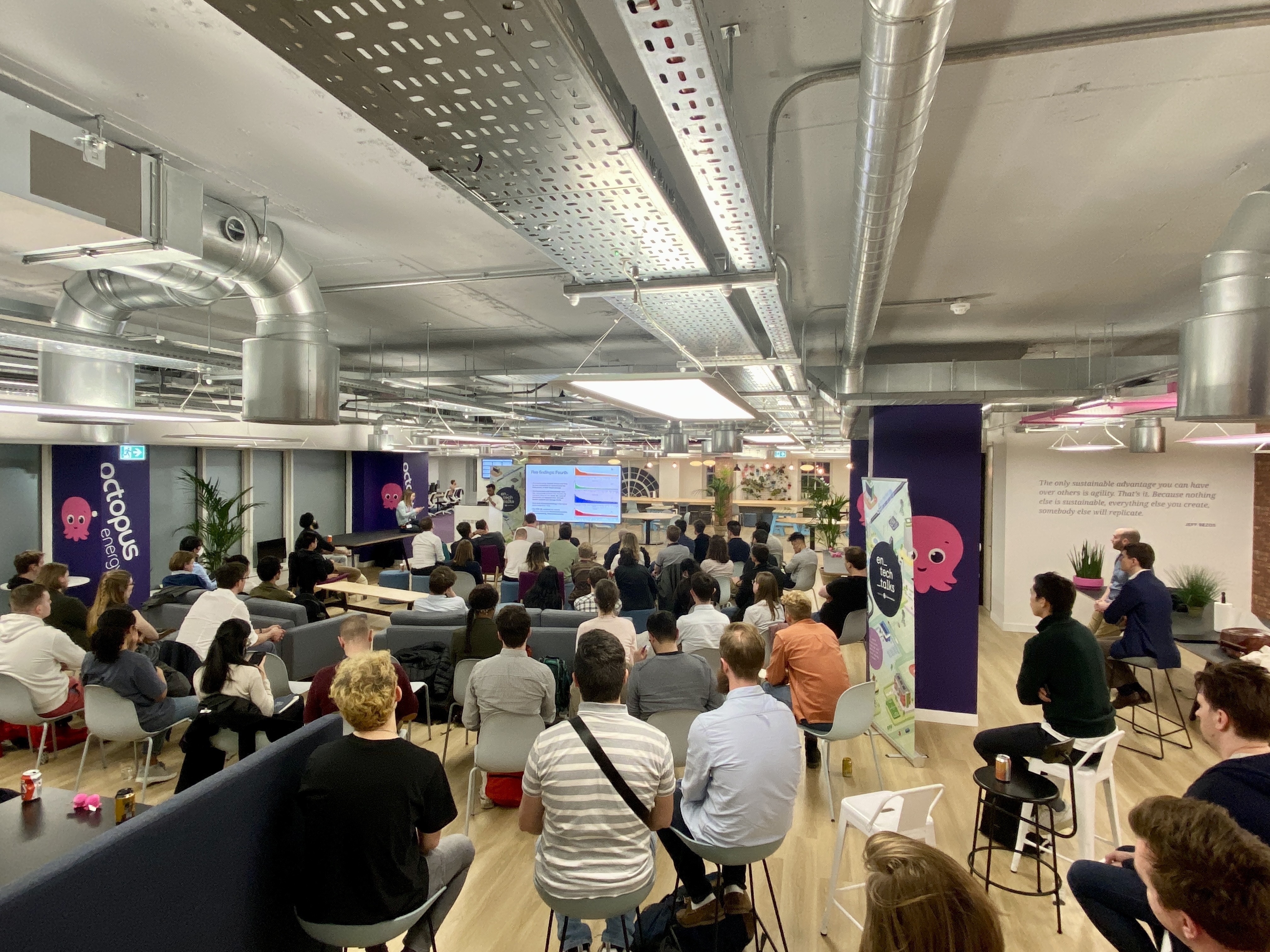 a picture of a room full of audience members attending the very first en_tech_talk