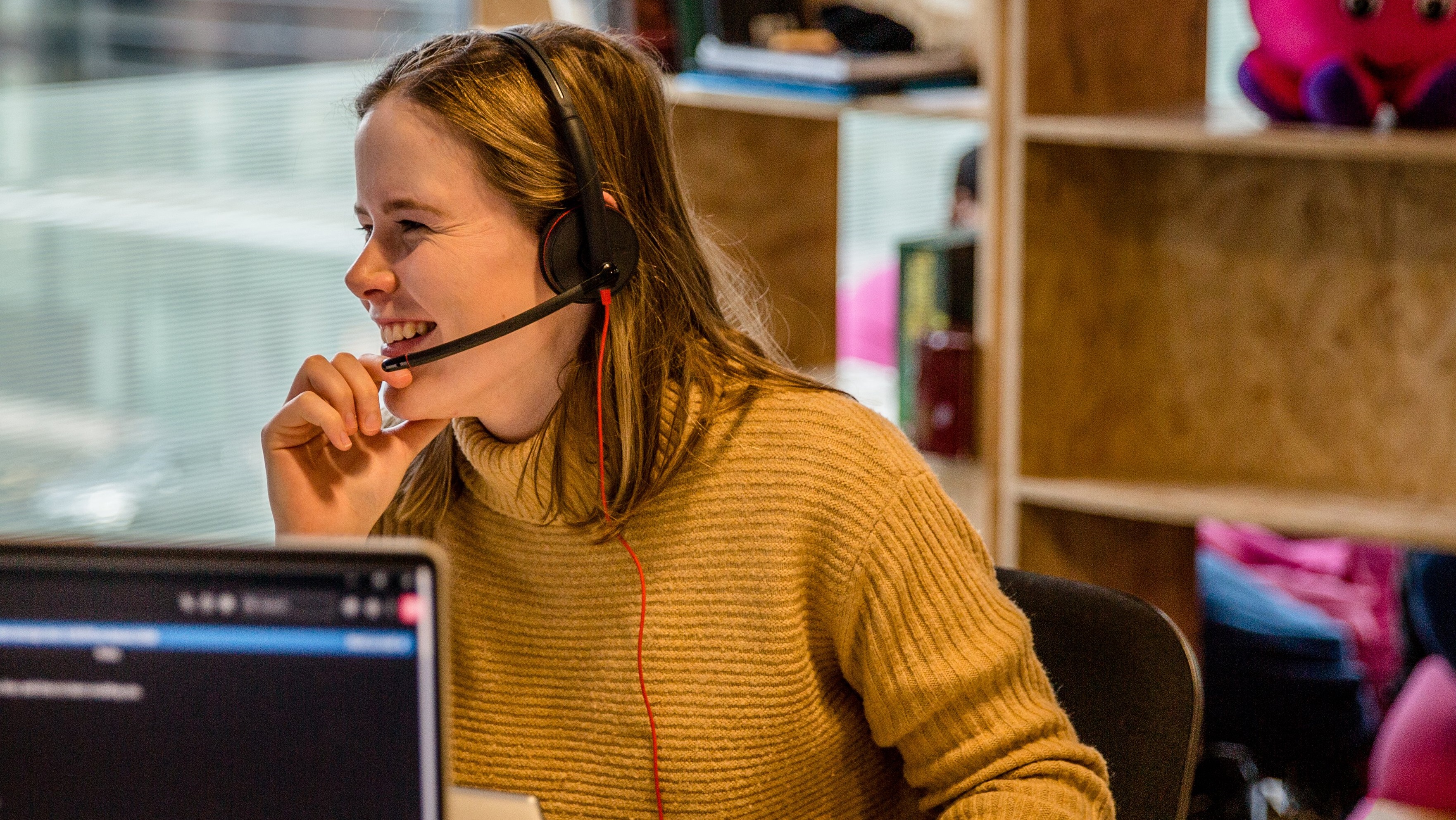 An image of an Octo-energy expert laughing on the phone