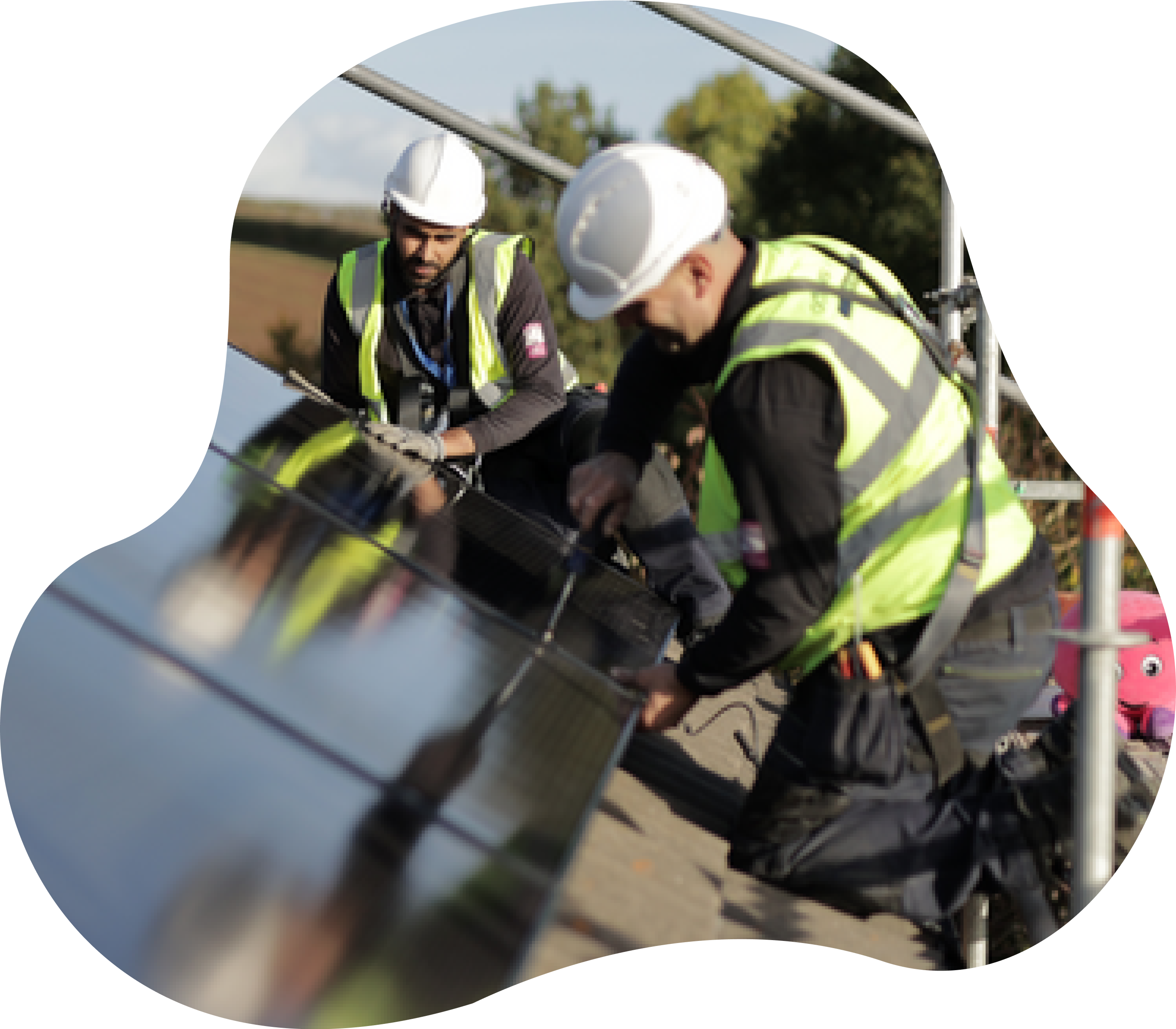 Engineers on roof installing solar panels