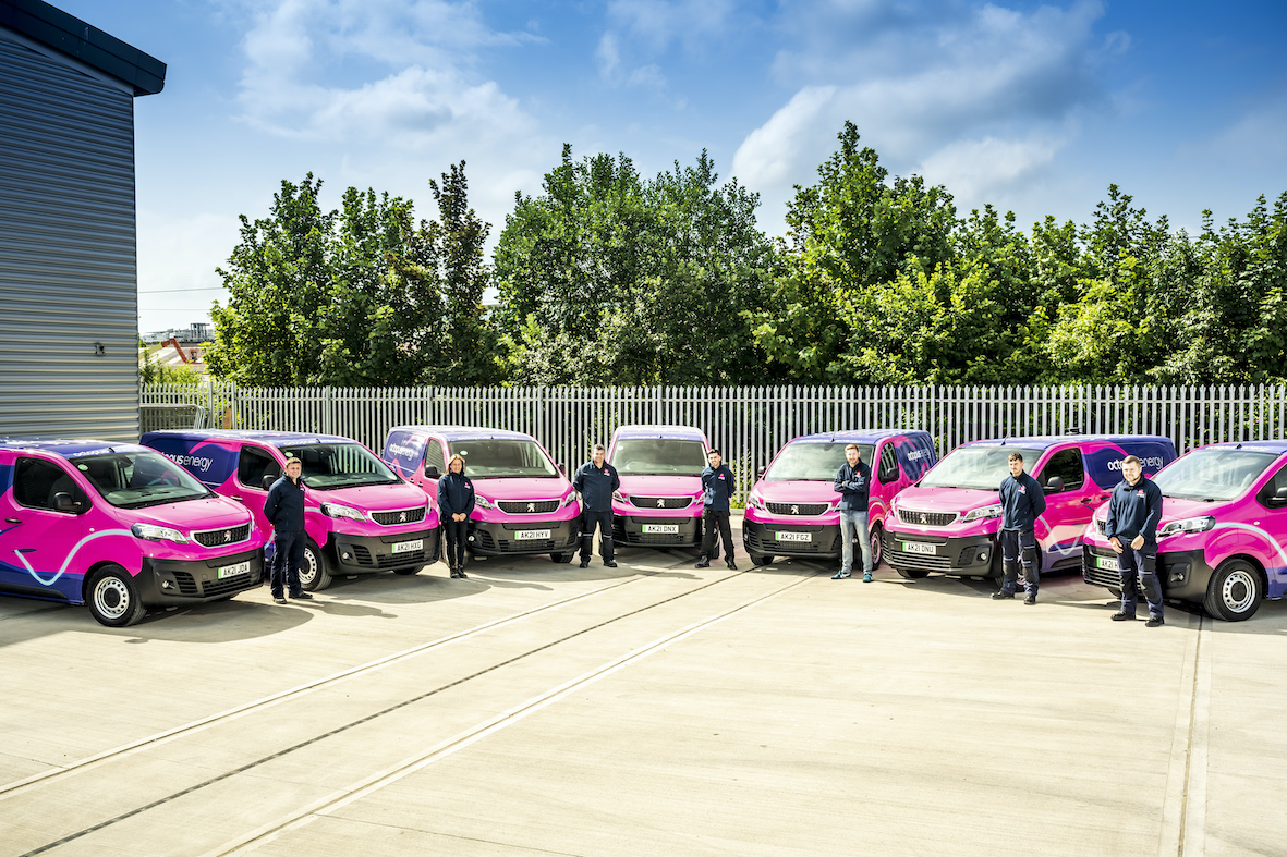 A photo of Octopus Energy Services engineers with their new electric vans