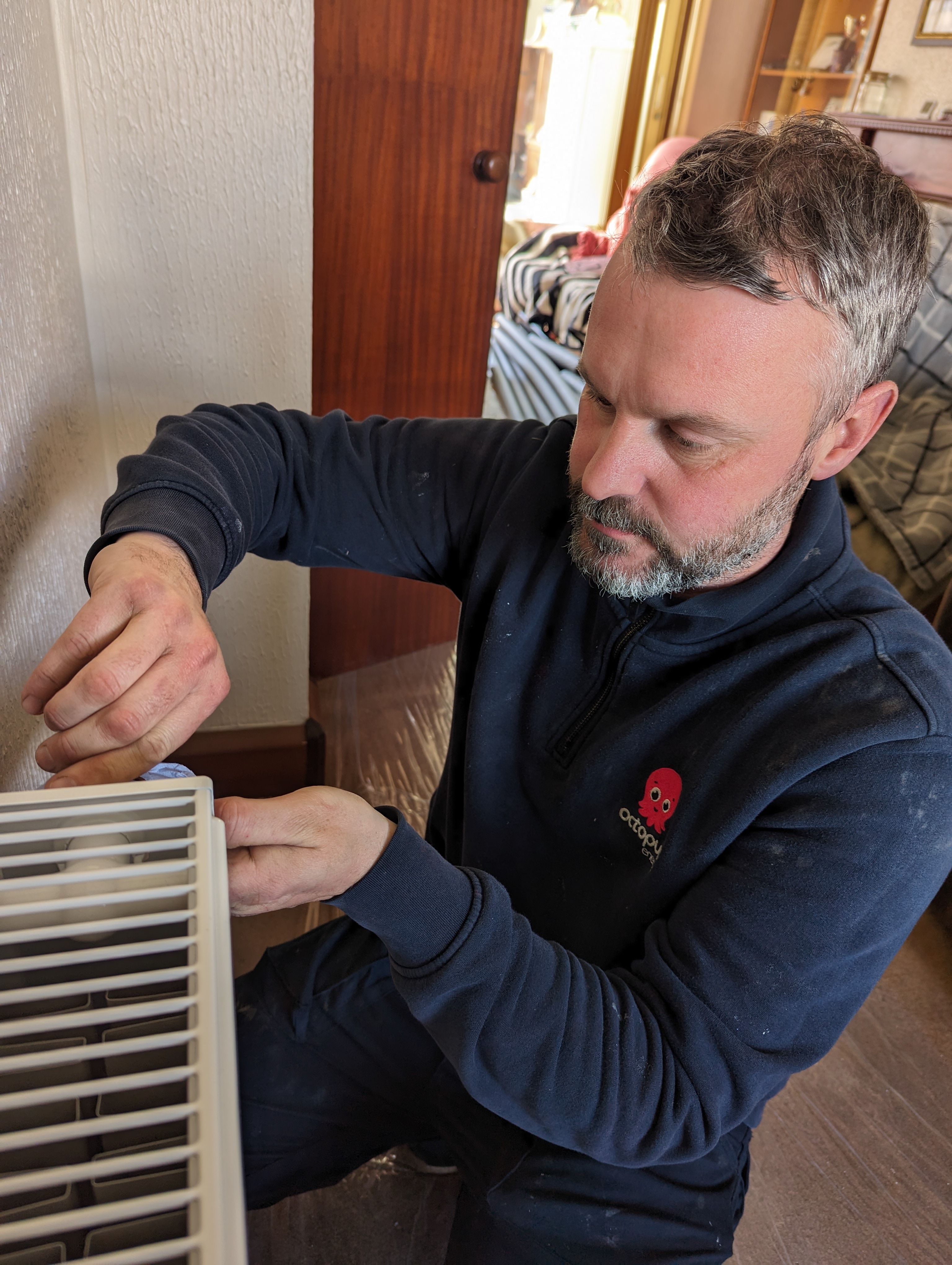 photo of nick working on heat pump