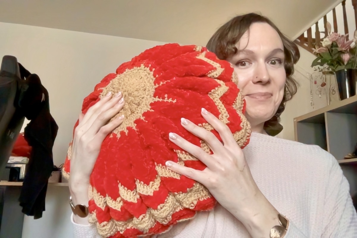 Steph with one of her crochet pillows