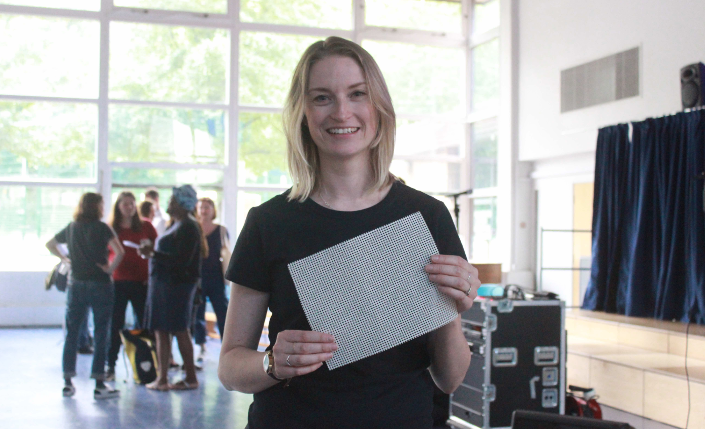 Samantha Kitchen holding ion-producing mesh to go on the school gate