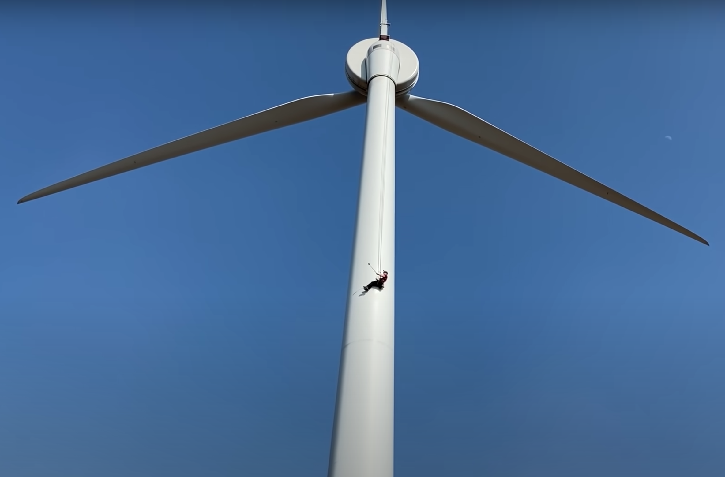 A photo of YouTuber Tom Scott abseiling down our wind turbine