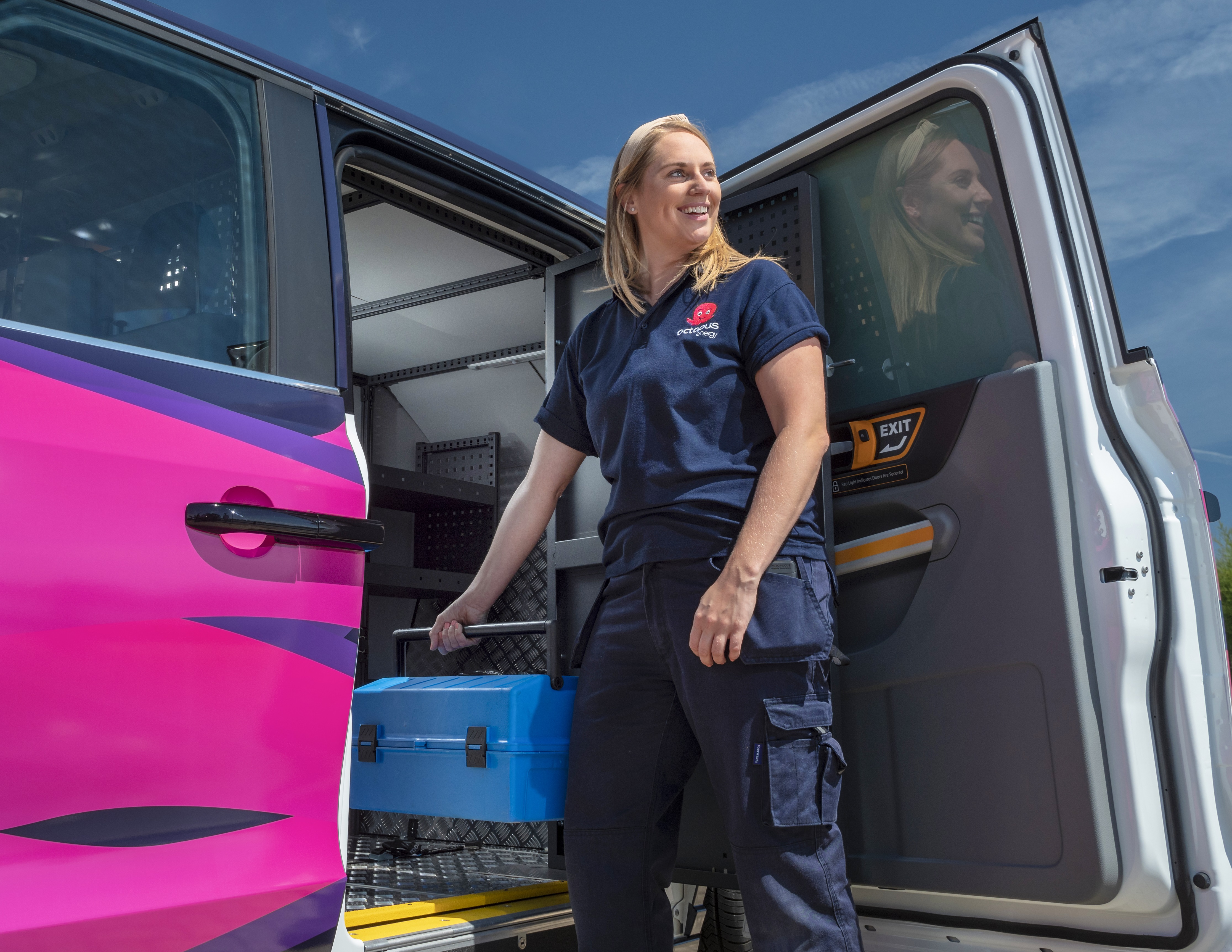 An image of Zoe next to her Electric Octopus Van
